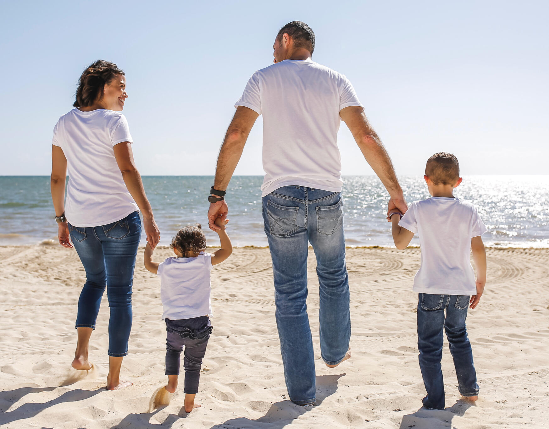 Photo of Amanda holding hands with her family
